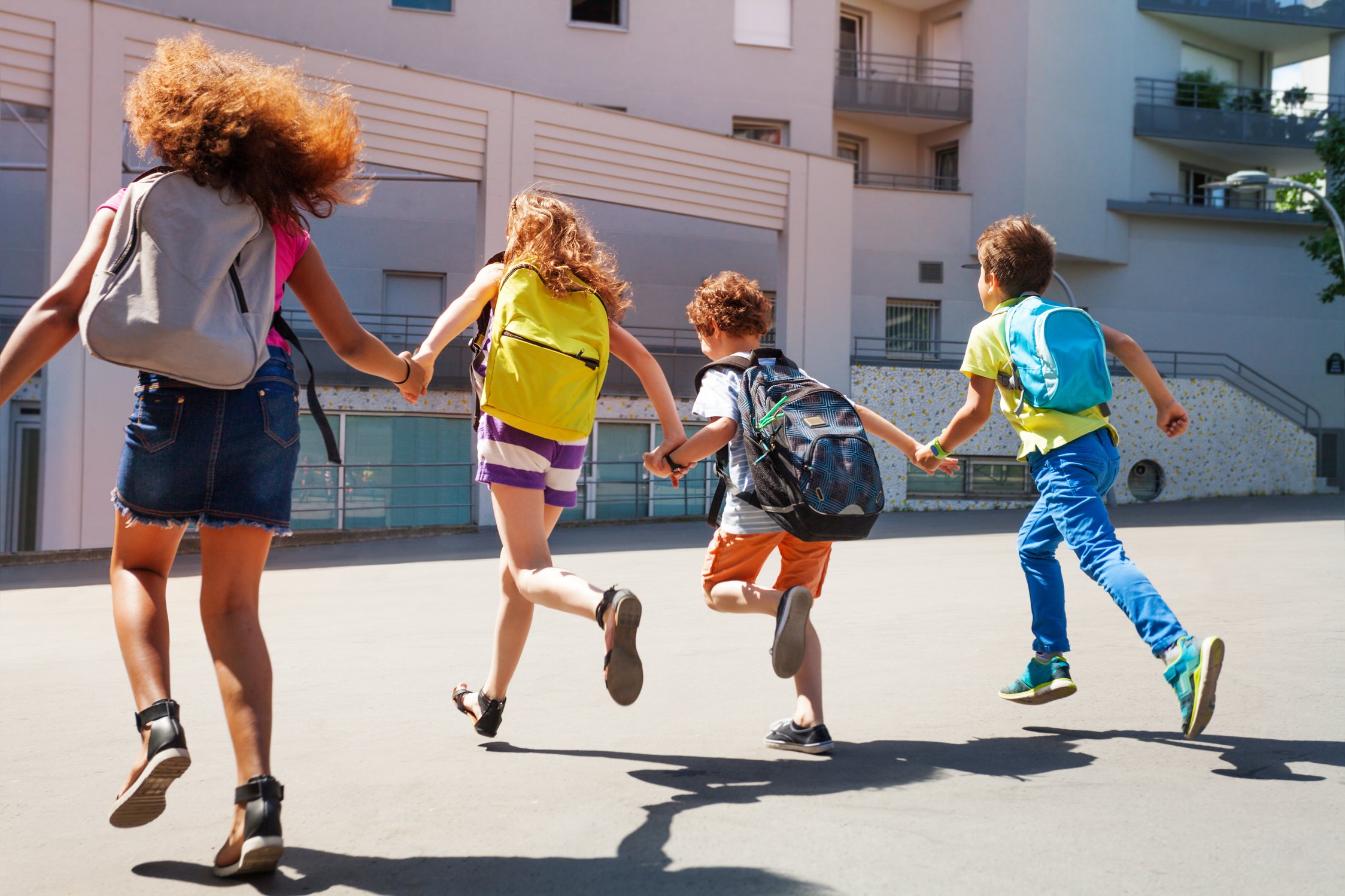 Kids with Backpacks Run to School